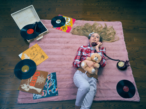 A girl is talking on a phone.